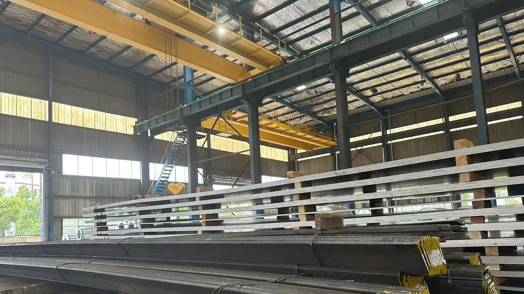 Overhead travelling crane above plate stacks in the ZCMetals warehouse in Wuhan